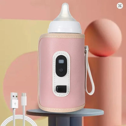 chauffe biberon nomade rose sur table